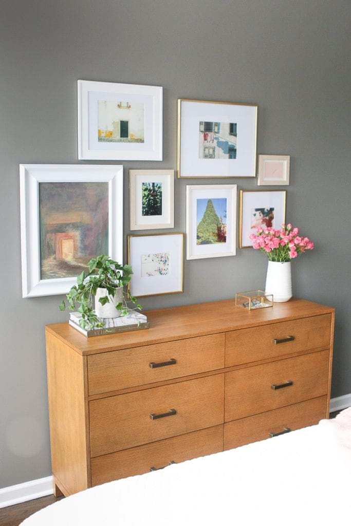 Asymmetrical gallery walls look good with a variety of prints and frame sizes