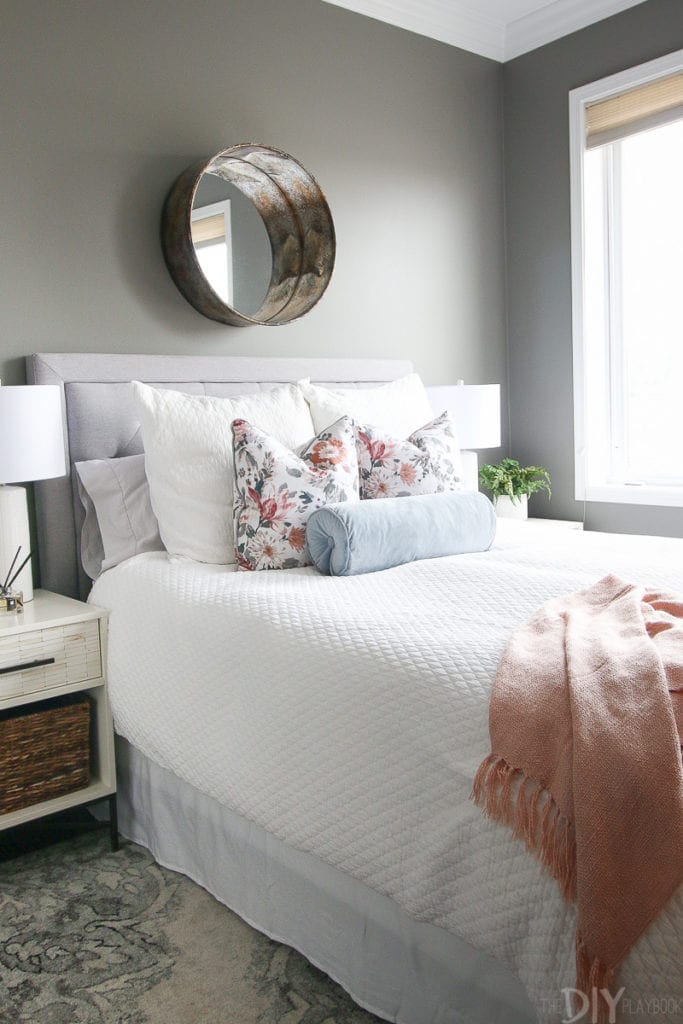 Gray guest bedroom with blush accents