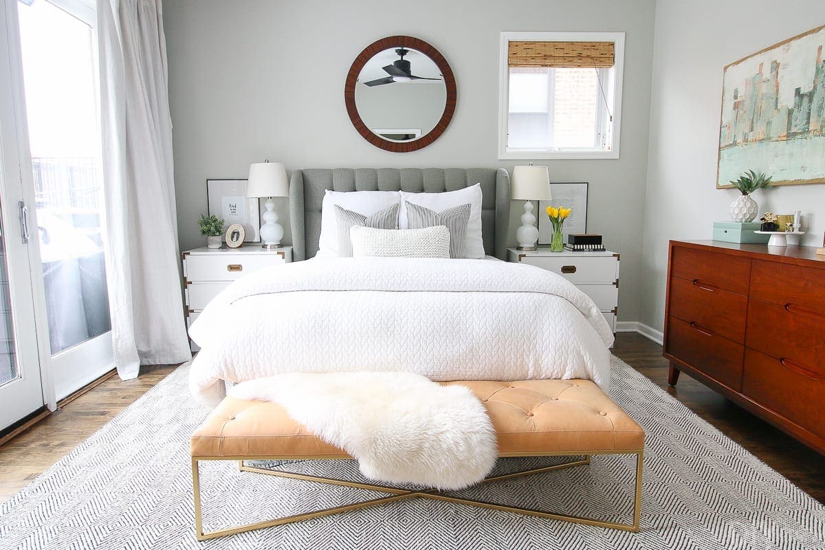 Chicago condo with a gray and white master bedroom. 