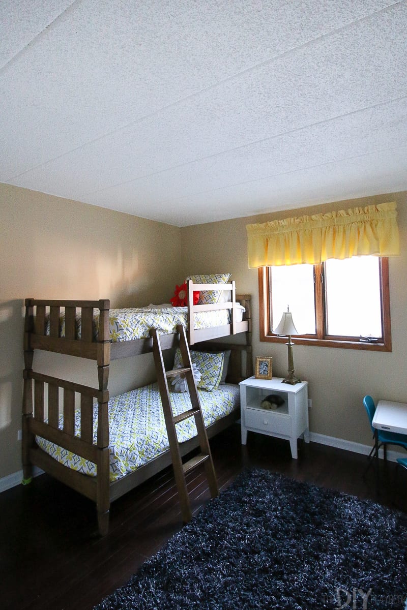 Before photo of a kids' room with bunk beds.