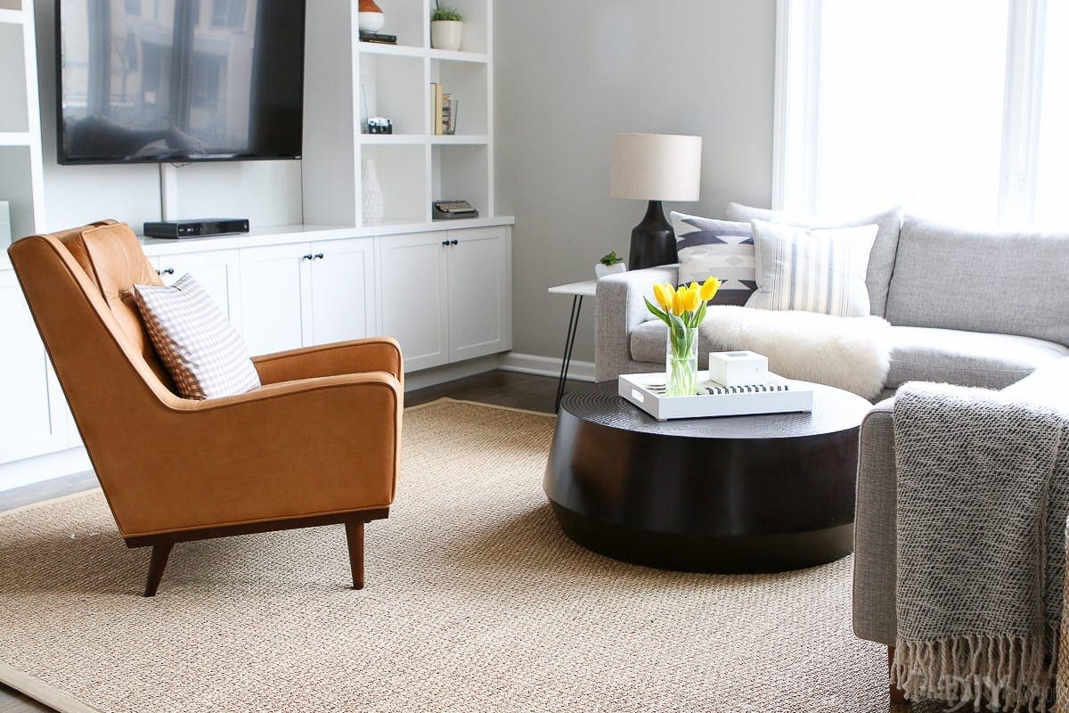 This black coffee table is styled to perfection in this family room. 