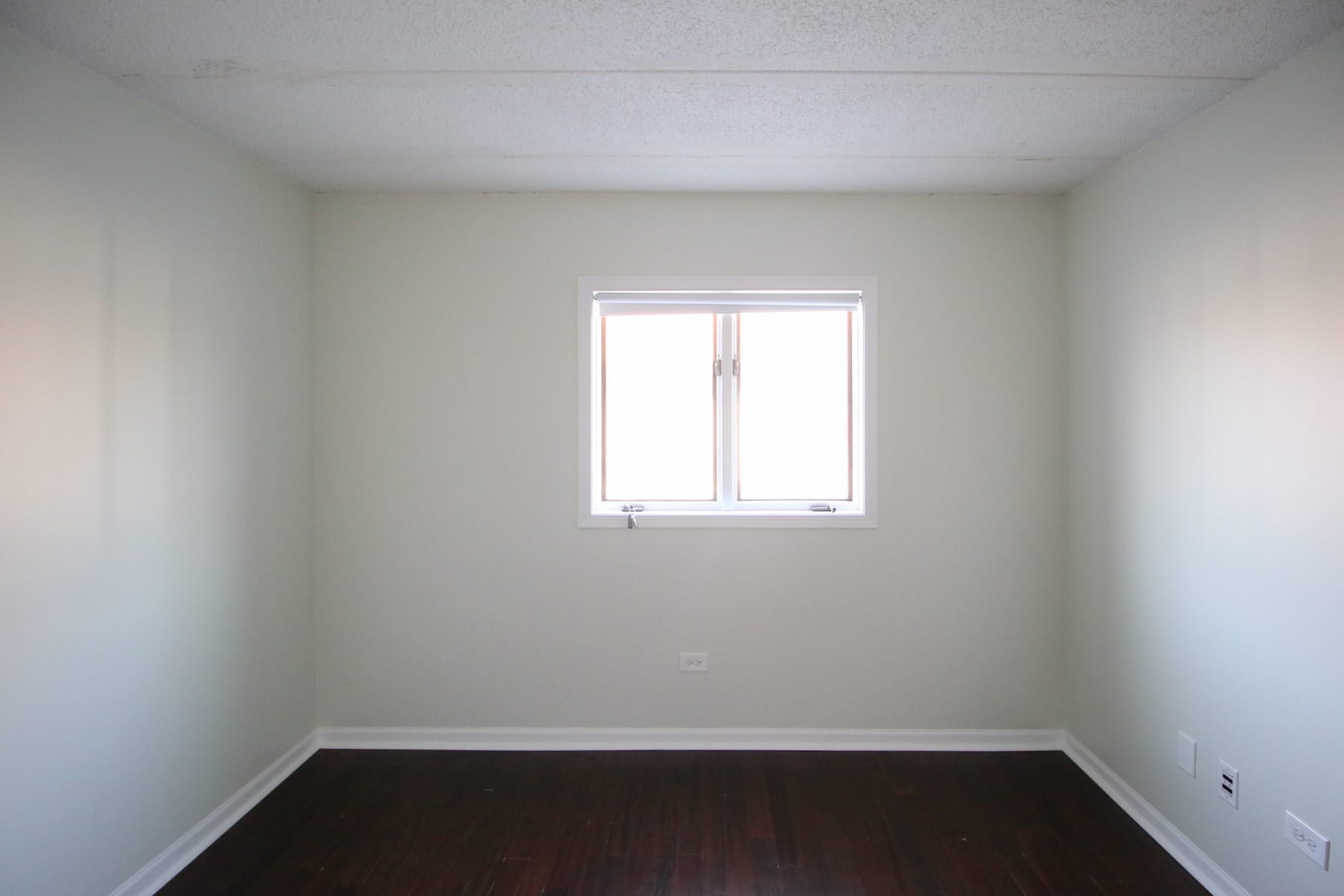 A kids' room before with popcorn ceilings. 