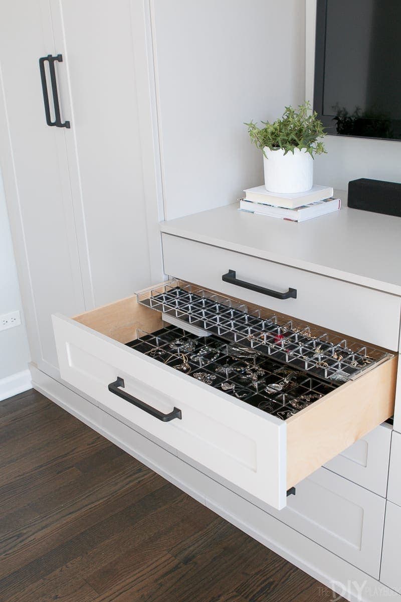 A drawer for jewelry in this master bedroom built-in unit. 