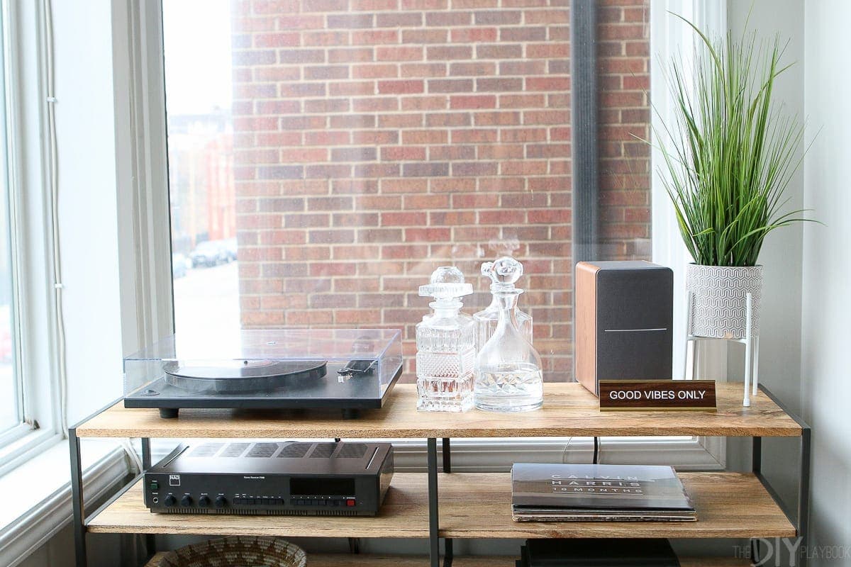 A record console with accessories and a record player