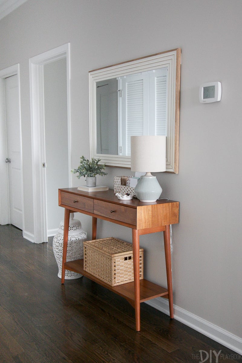 Create a functional entryway space using a slim console, large mirror, and lamp! 