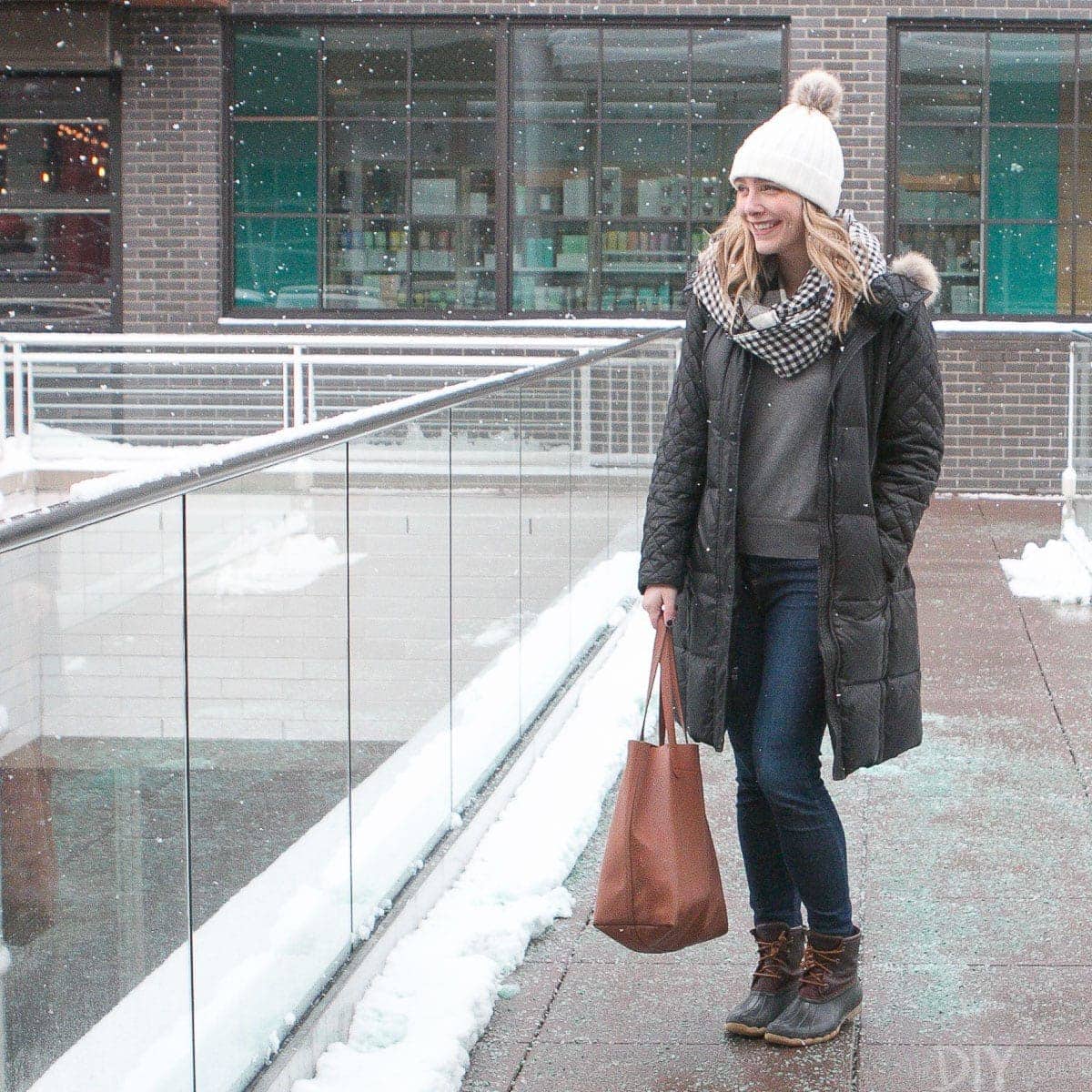 Casey outside in the snow all bundled up for winter. 