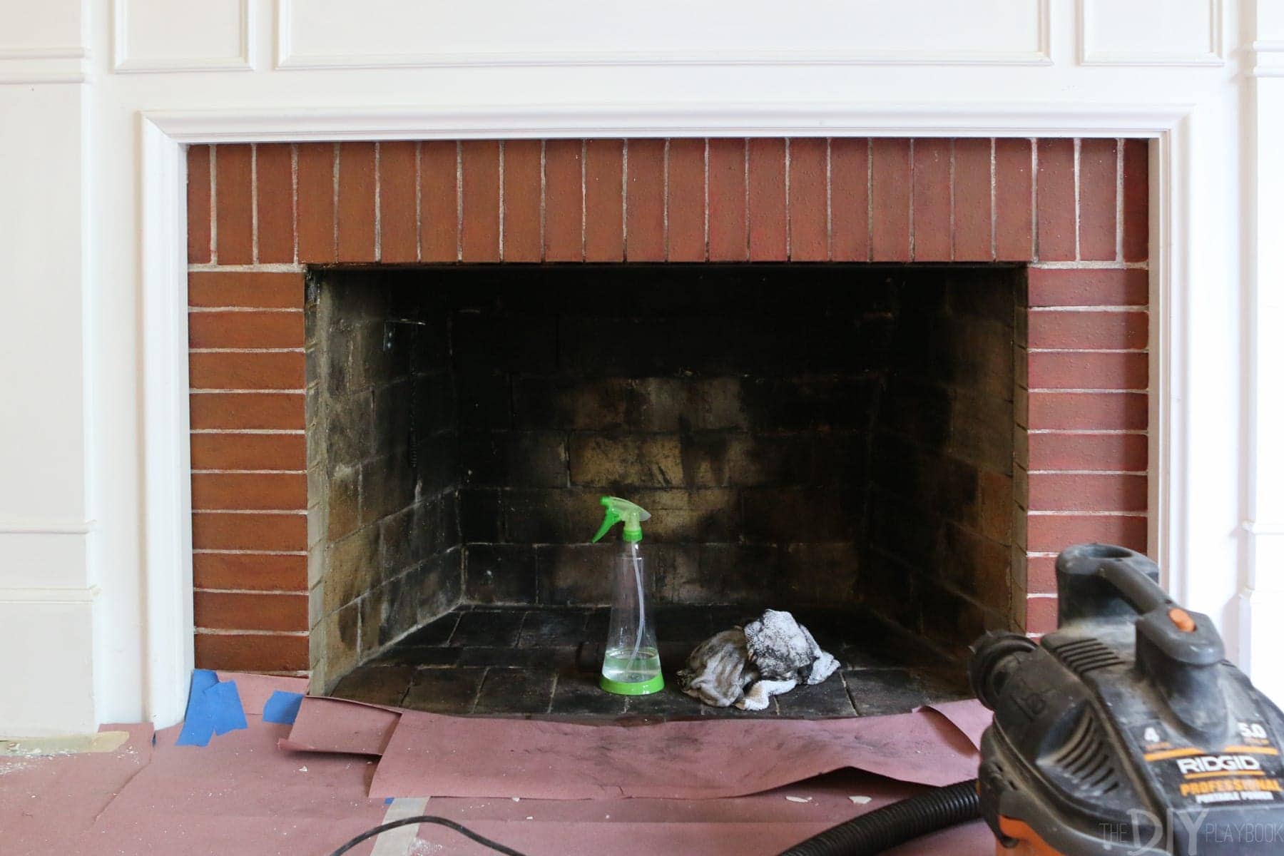 cleaning out the inside of a fireplace