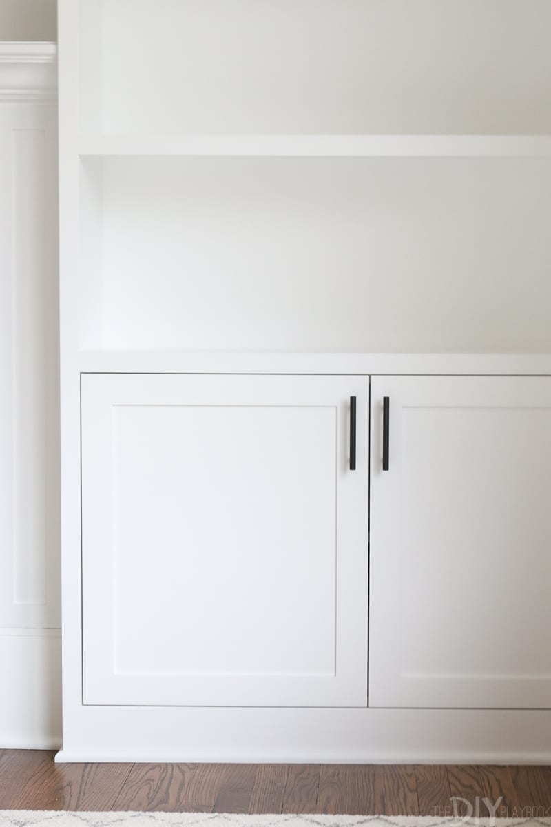 white built-ins with black hardware