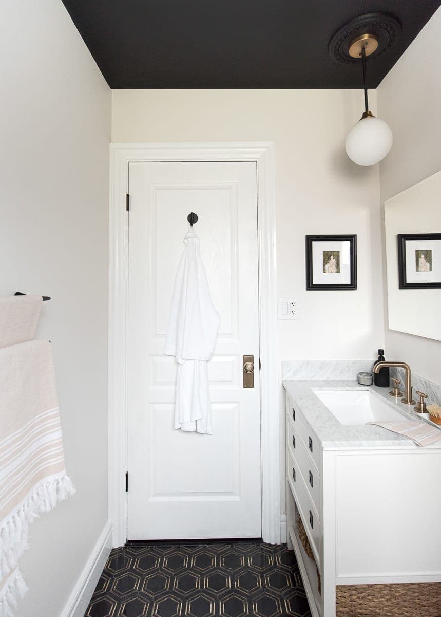 Black, white, and marble bathroom space. 