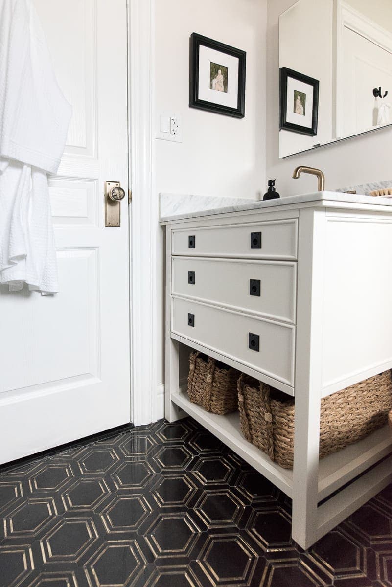 A white vanity with marble top from the blog Room for Tuesday. 