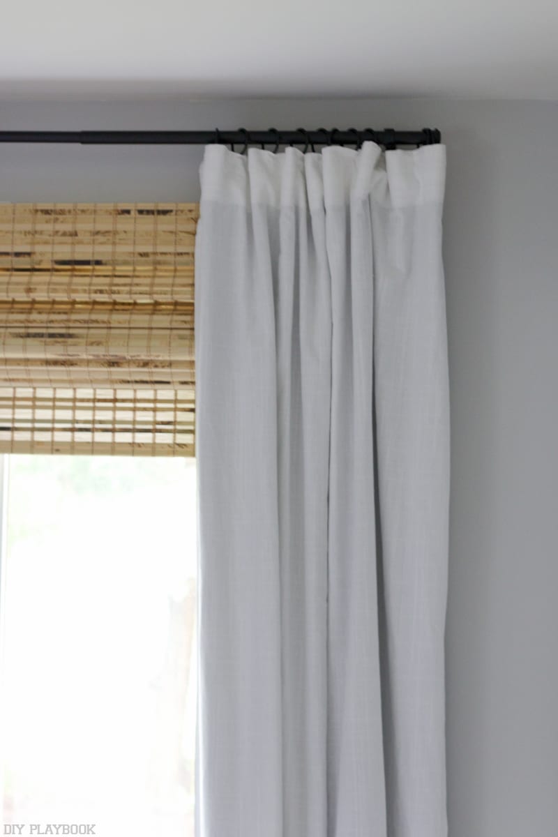 bamboo shades and white curtains