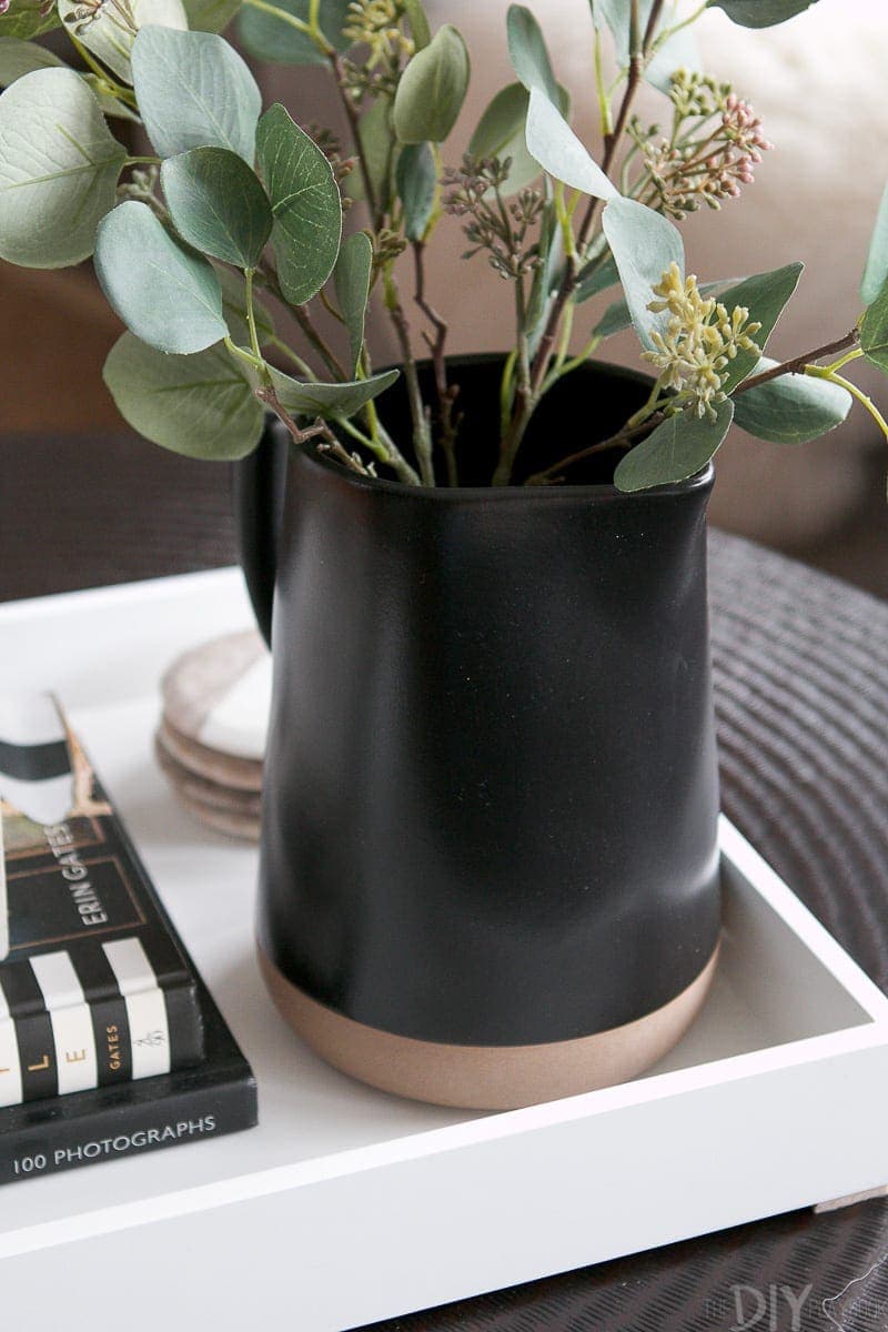 Faux eucalyptus sprigs from Target work perfectly in this black pitcher. 