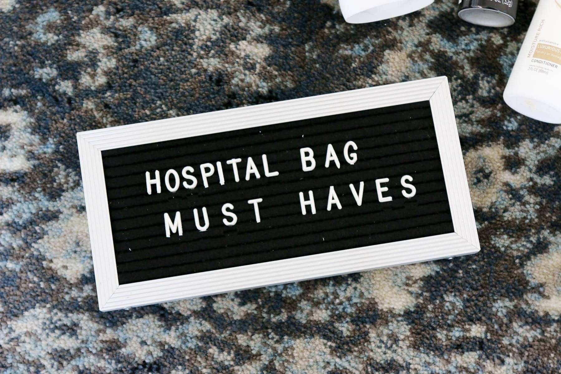 Hospital Bag Must Haves, including a letterfolk sign or any other fun "props" you may want for newborn photos