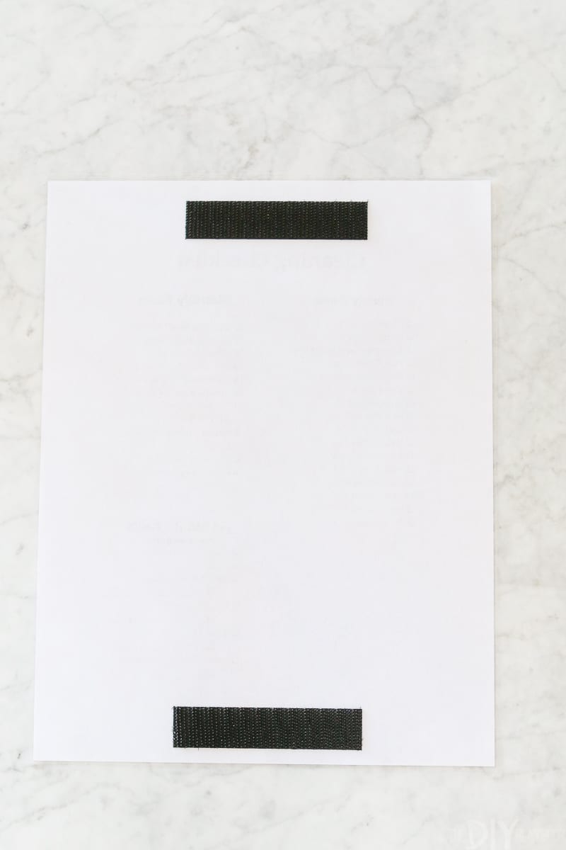 Velcro on the back of a cleaning checklist to hang easily