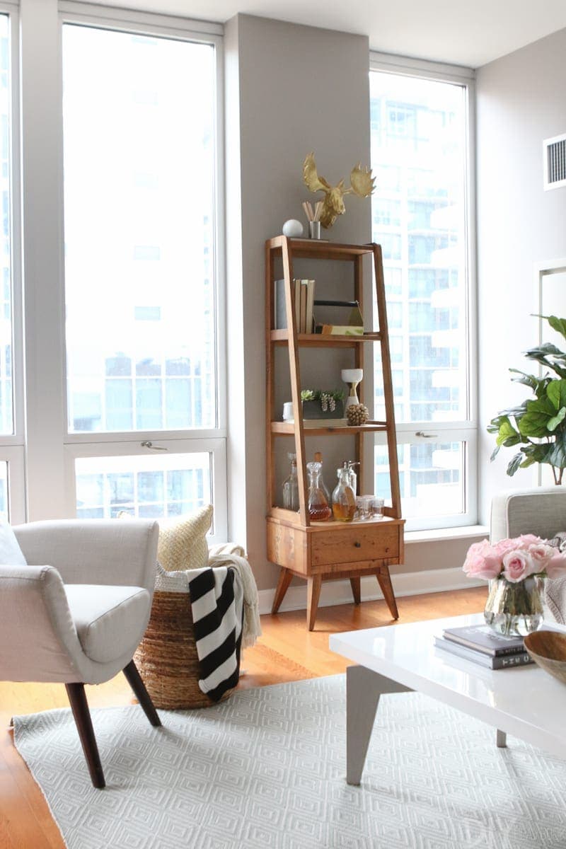 This wooden shelving unit fits perfectly against the wall. 