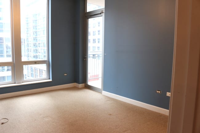 Another bedroom before. The door to the balcony is amazing, the blue walls are not. 