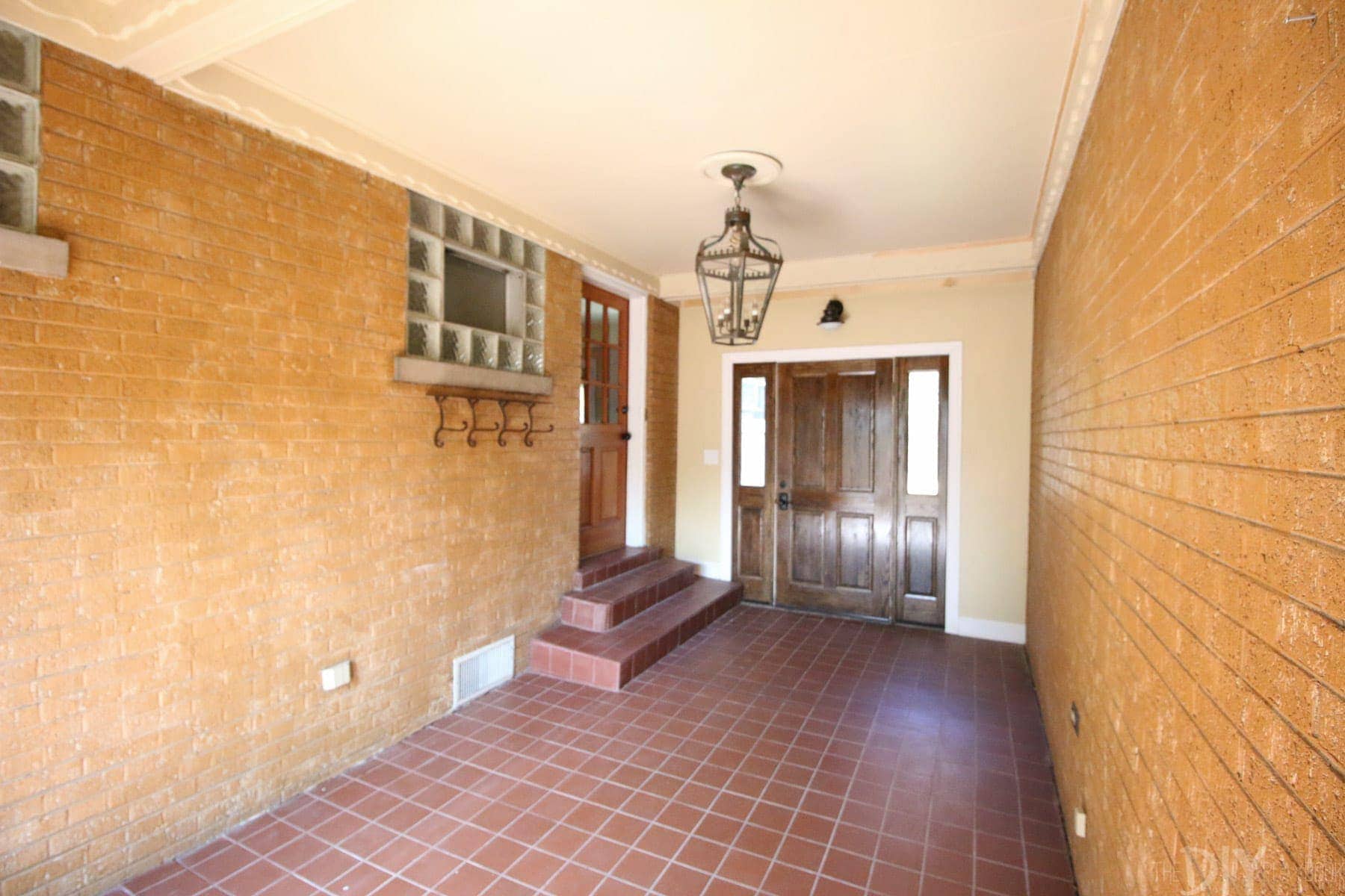 Photo taken from the steps of the garage looking down into the breezeway mudroom. 