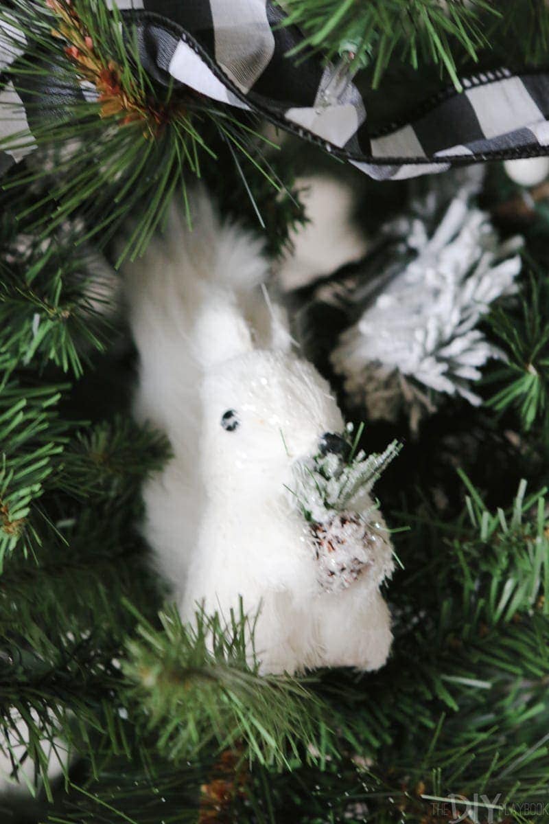 How amazing is this litle white squirrel? He's hiding in the branches of our black and white Christmas Tree. 