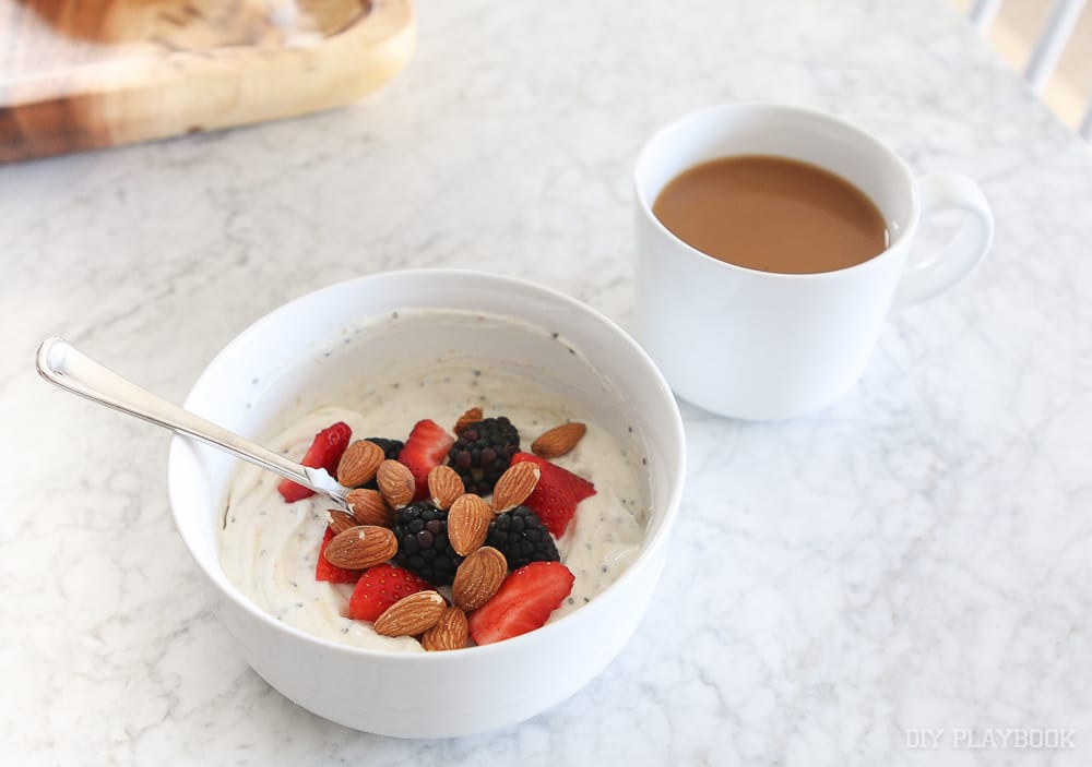 A simple breakfast of yogurt, coffee, nuts and fruit