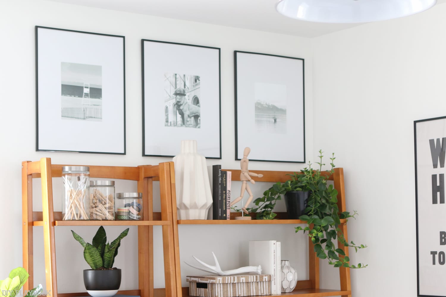 This draws the eye up: 6 Ways to Decorate with Picture Frames | DIY Playbook