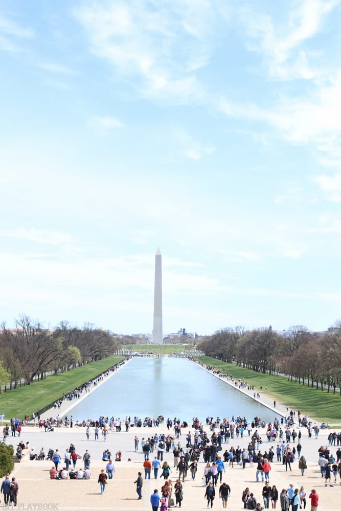 The Washington Monument above the famous reflecting pool in DC in the springtime. 