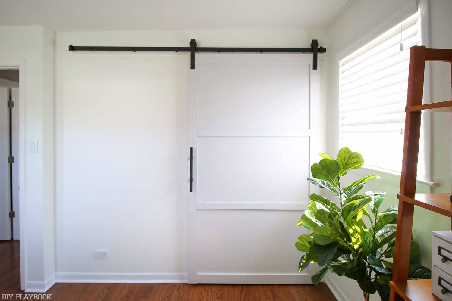 Move it all back into place: How to Hang a Barn Door in your Home DIY | DIY Playbook