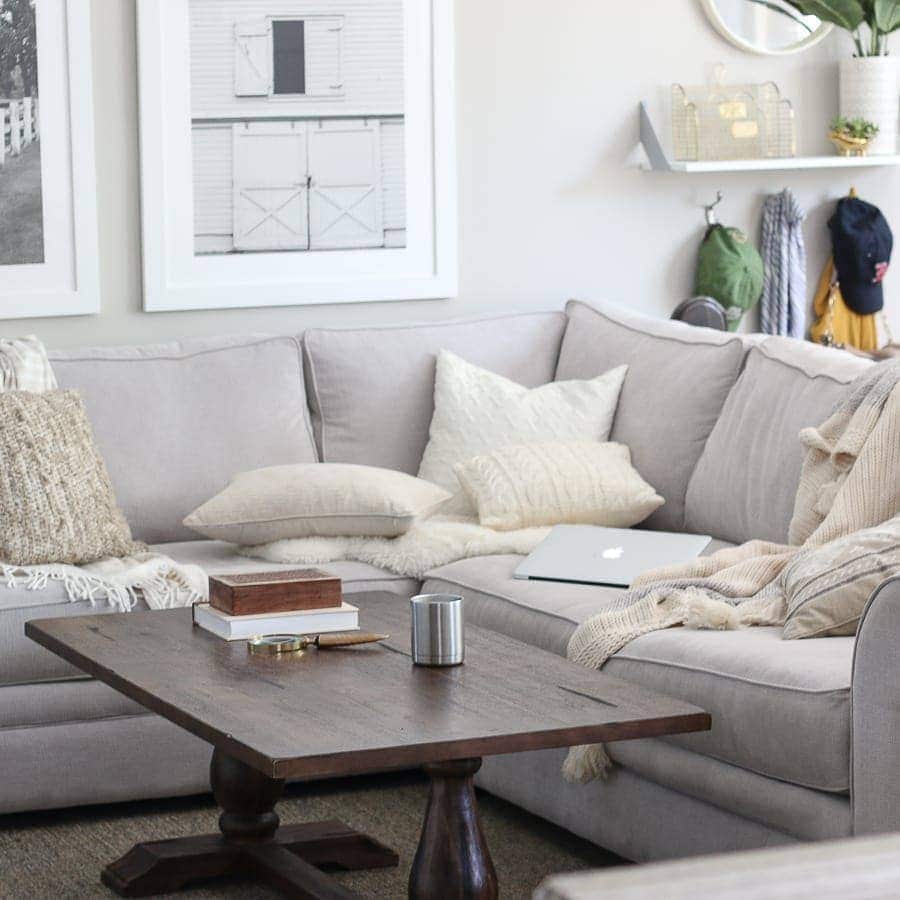 One Way To Add Hygge To Your Home is to make your coziest spaces even cozier, with pillows, throws and candlelight. 