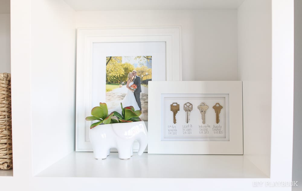 Use a shelf: 6 Ways to Decorate with Picture Frames | DIY Playbook