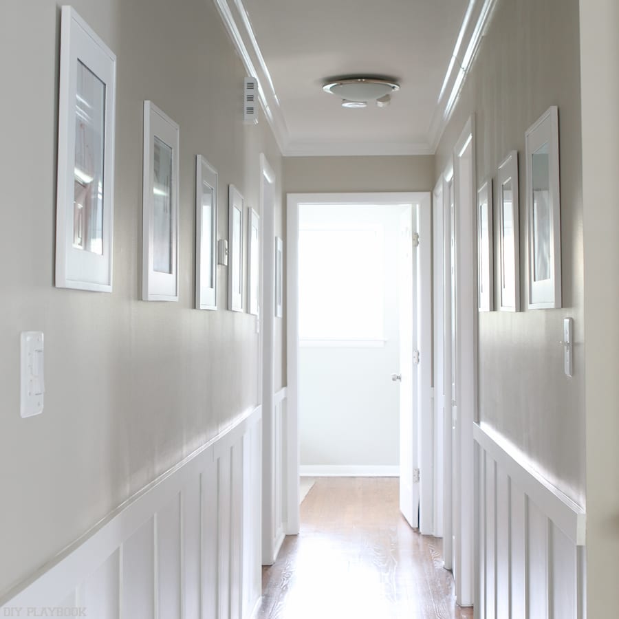 They draw the eye down the hallway: 6 Ways to Decorate with Picture Frames | DIY Playbook