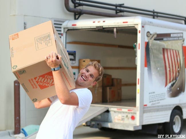 Casey's husband is happy to help move boxes. 