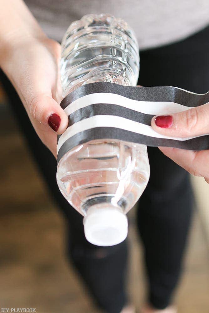 Using Washi tape is another fun, easy decorating pro-tip. We used black and white tape on these plain water bottles. 