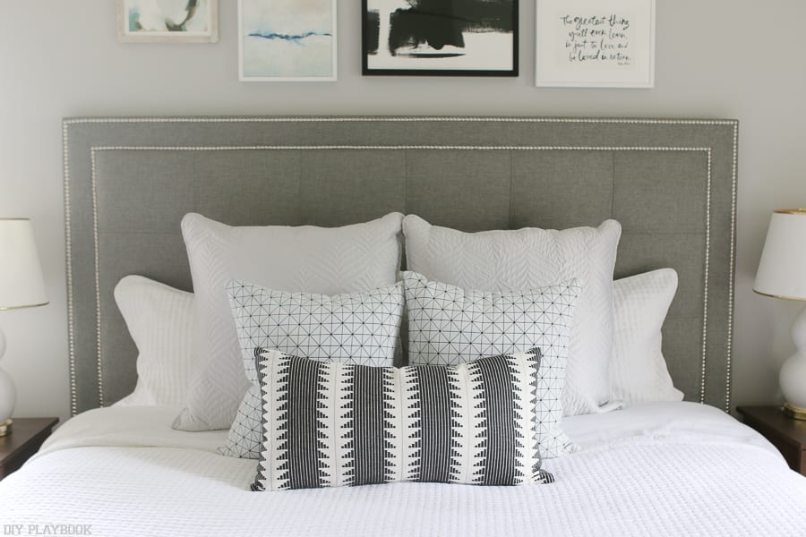 That headboard! This stunning bed and accent pillows are stunning