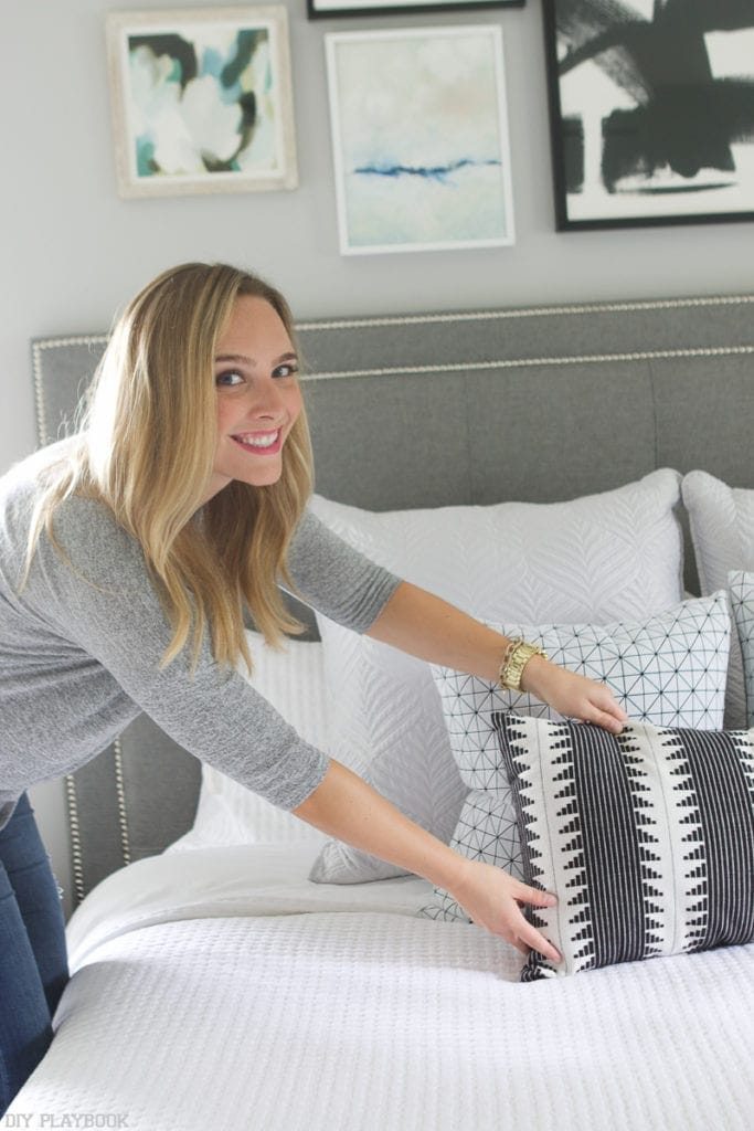 Casey adding some finishing touches to the bedroom