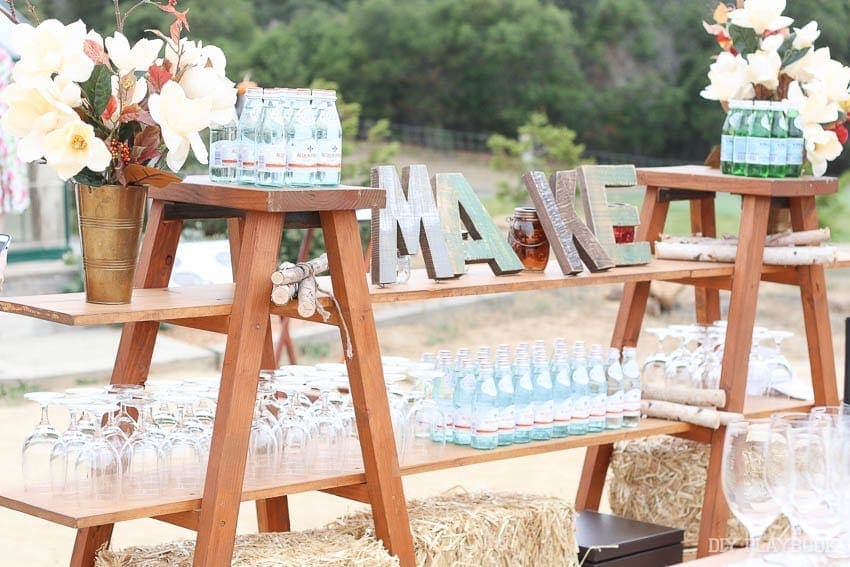 Using twin ladders as a novel take on an outdoor bar at the Michael's Makers Summit. 