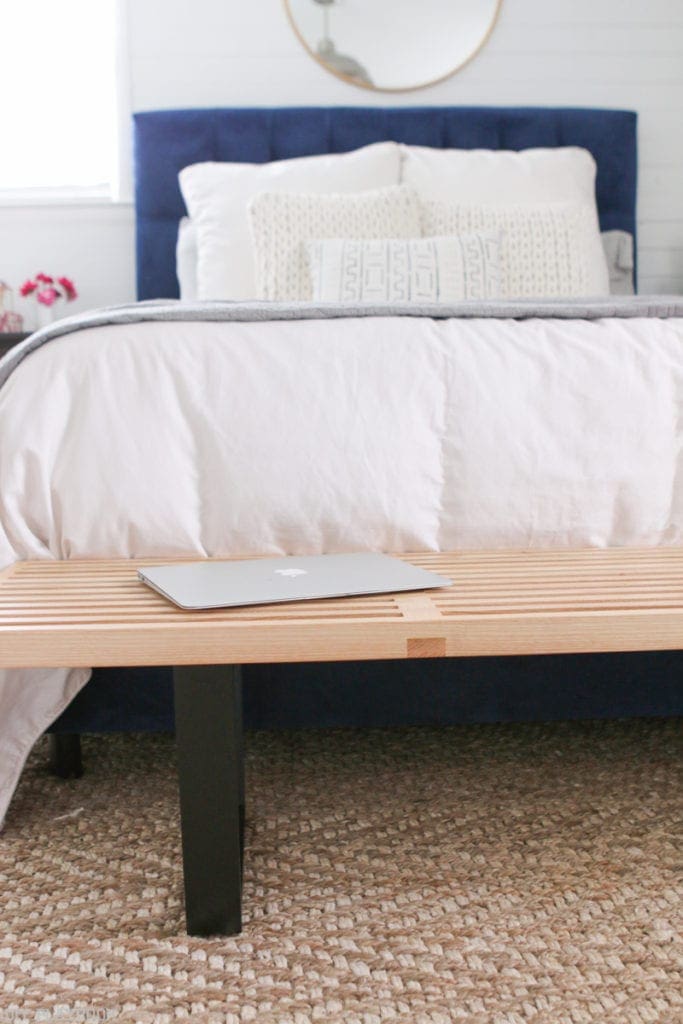 Bedroom with George Nelson-style Mid Century Modern bench at the foot of the bed. 