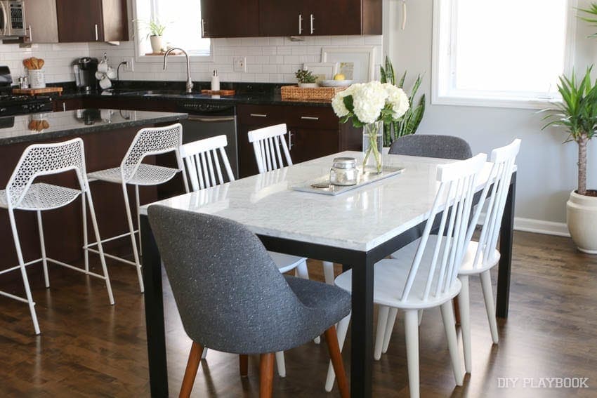 this bright and neutral dining room is small but functiona