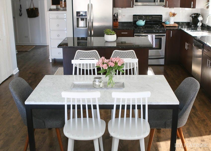 mixing and matching chairs and styles is a fun way to bring style to the room