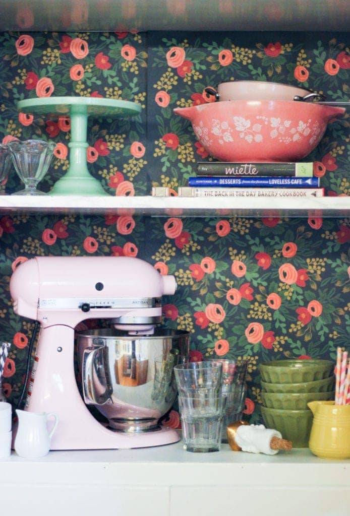 9 Decorating Ideas for Renters: Line the backs of kitchen cabinets with wall paper or other paper that can be easily removed. What a great way to add color!