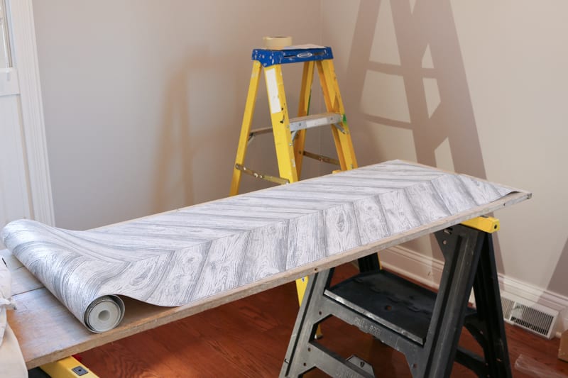 Set up a flat work space to lay your wallpaper out on. 