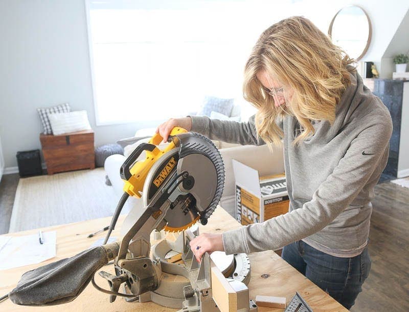 Using the saw to cut board for the hallway makeover. 