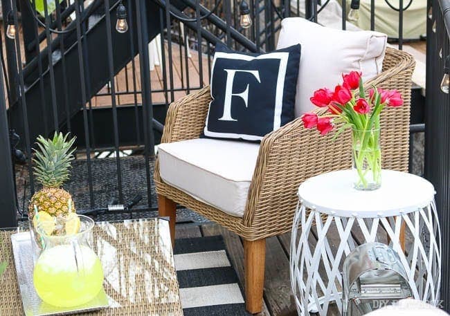 The "F" throw pillow on the wicker chair is for Finn of course! And how cool is that side table?