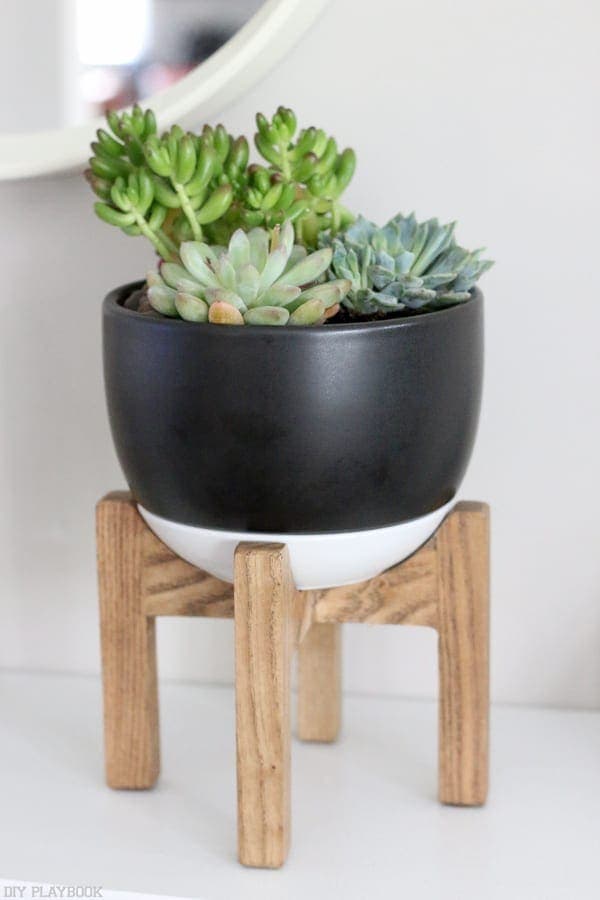 Target plant stand planter with easy-care succulents are a great mid-century modern look. 