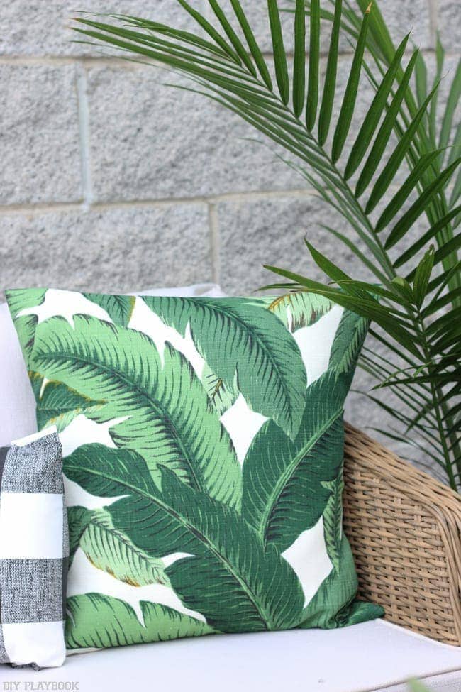 A palm frond throw pillow with outdoor fabric, perfect for the balcony!