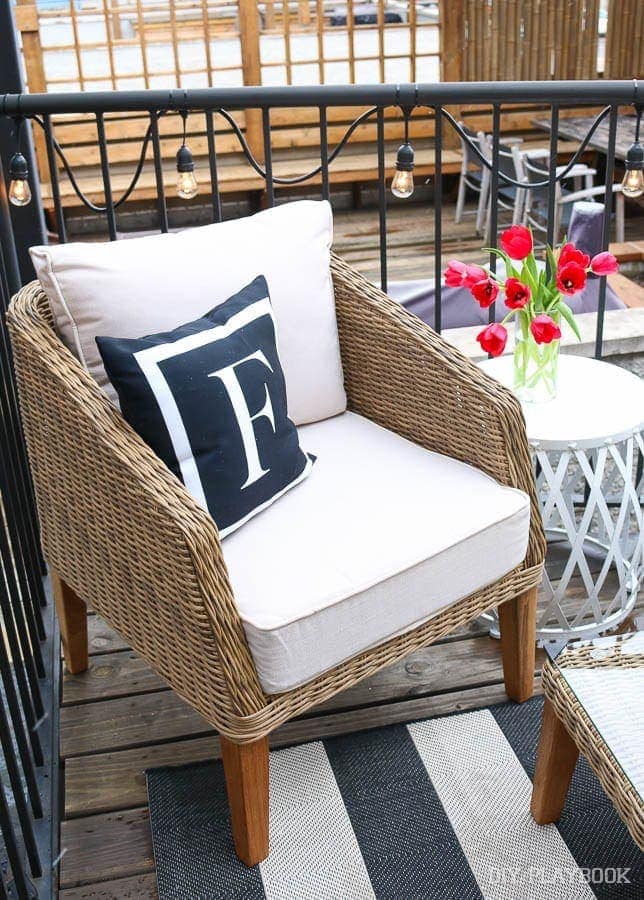 Another shot of my favorite monogrammed "F" pillow! Along with our adorable wicker chair and white garden stool. 