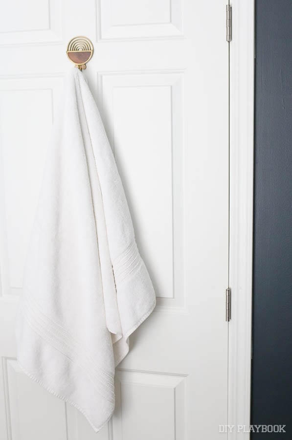 Here's the amazing brass and gold towel hook - doesn't it look great against the white door? 