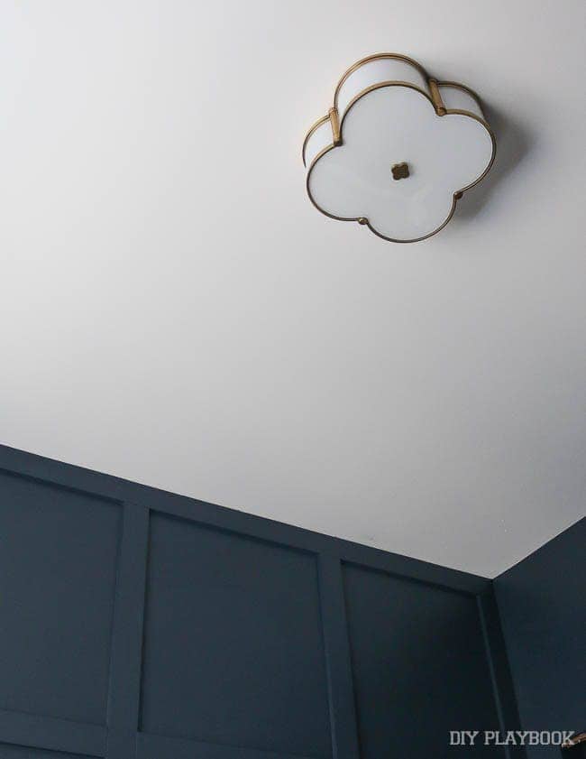 This new light fixture in my guest bedroom provides a warm glow against the dark, blue walls.