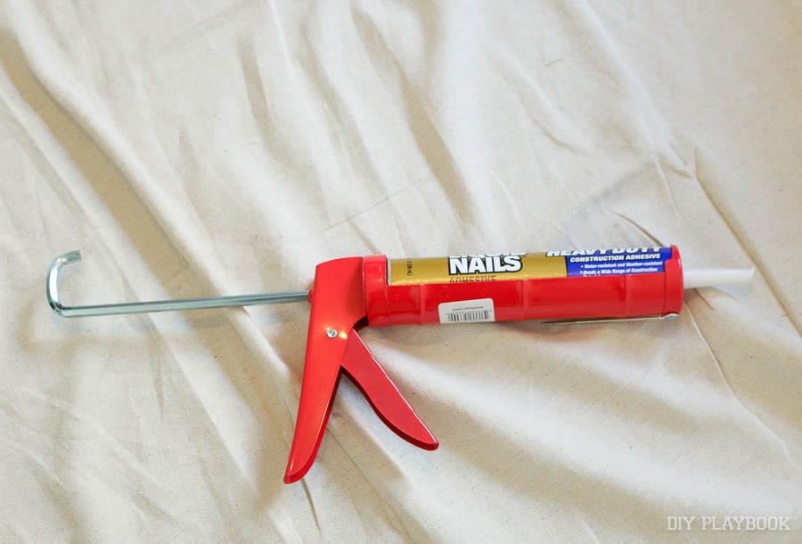 Using liquid nails in a caulking gun. 