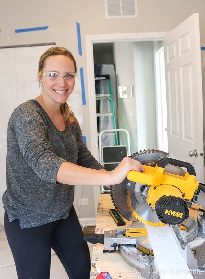 Casey using the miter saw to get the horizontal pieces of board. 