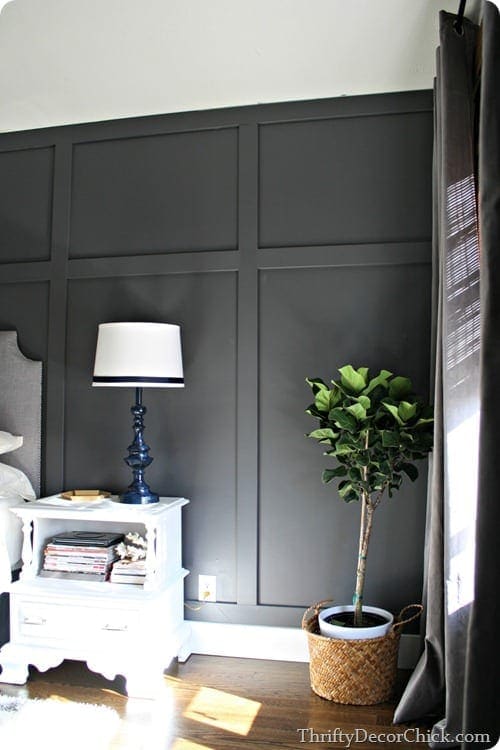 This chic wood wall adds drama and draws attention to the guest room. 