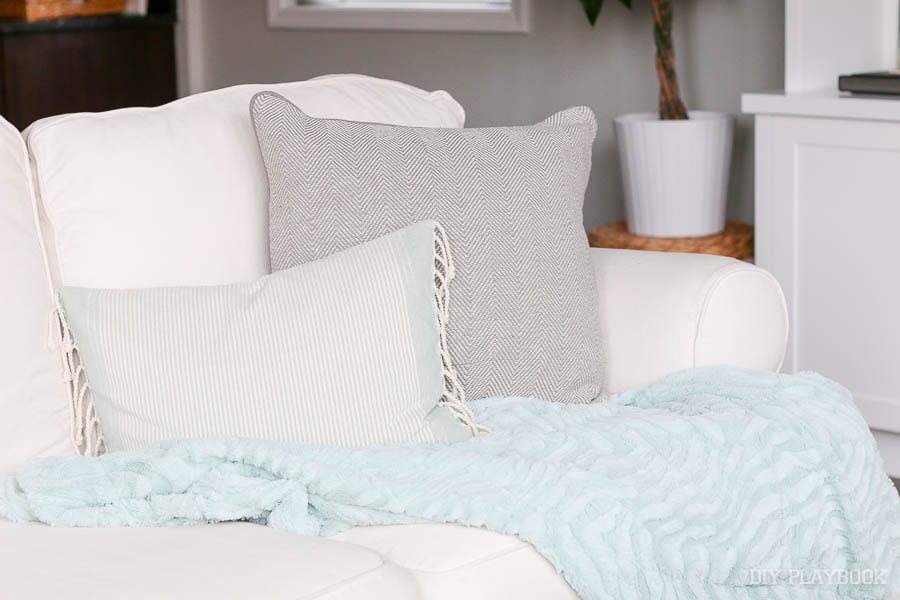 Add pillows: How to Style Your Couch: Easy DIY Design | DIY Playbook